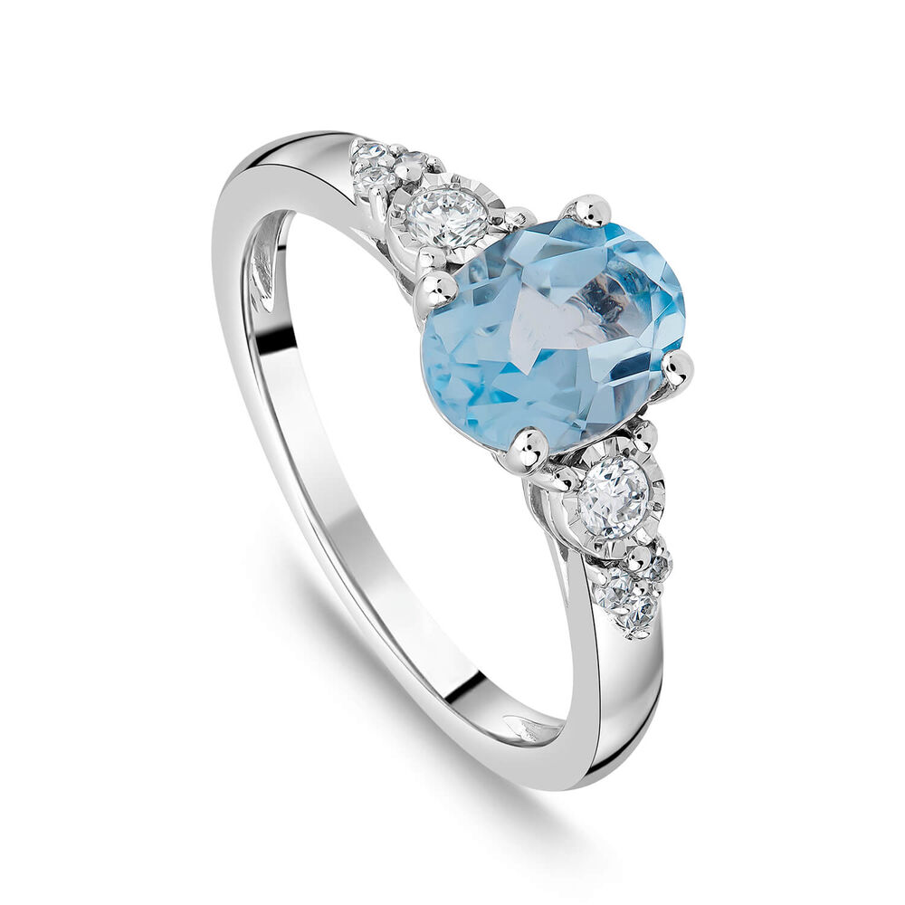 9ct White Gold Oval Blue Topaz Centre 0.14ct Diamond Trefoil Sides Ring