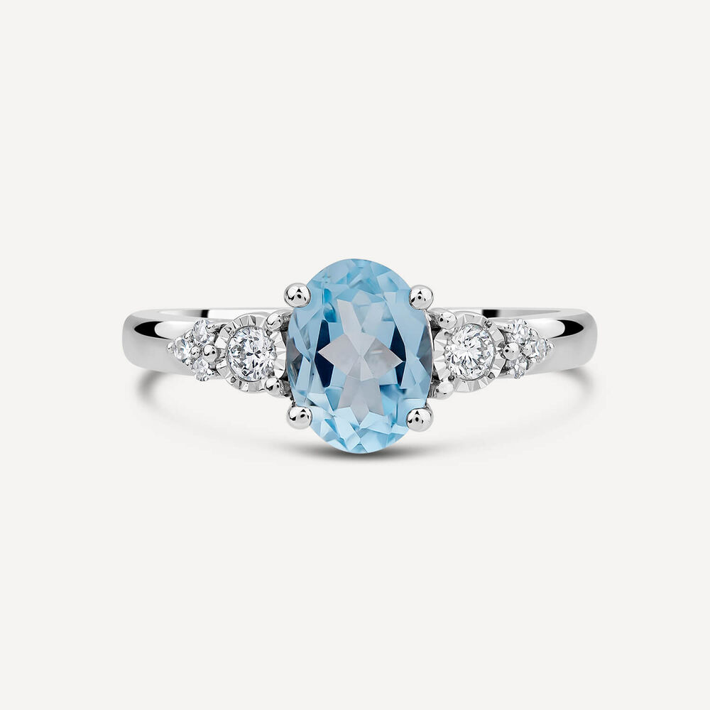 9ct White Gold Oval Blue Topaz Centre 0.14ct Diamond Trefoil Sides Ring