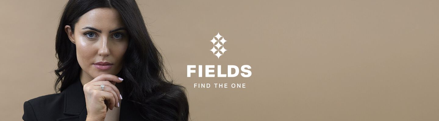 Fields engagement ring campaign banner featuring a woman showcasing a diamond engagement ring with the tagline 'Find The One